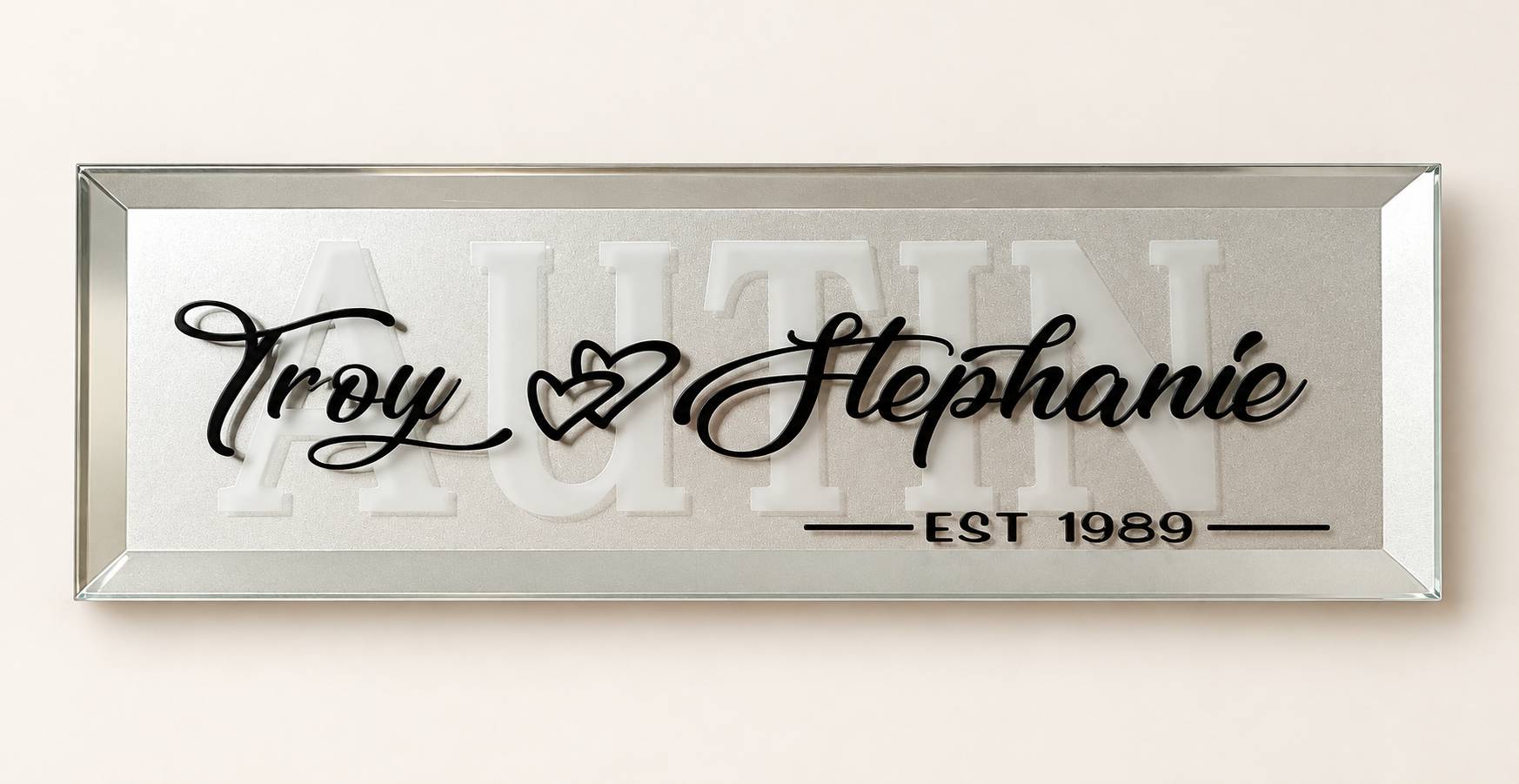 A wide personalized keepsake mirror with Troy and Stephanie in black script over a large family name, marked EST 1989